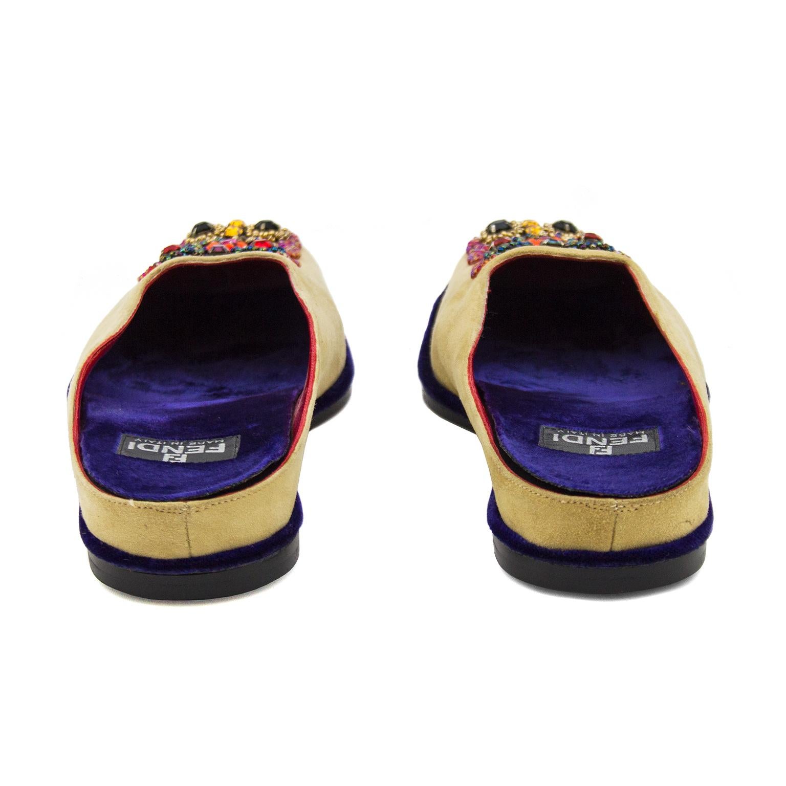 Beautifully beaded light tan suede Fendi slipper slides from the mid 2000s. Inspired by traditional Indian Jootis style shoes, they have an intricately beaded toe design and purple velvet insoles and trim. The soles of the shoes are in immaculate,