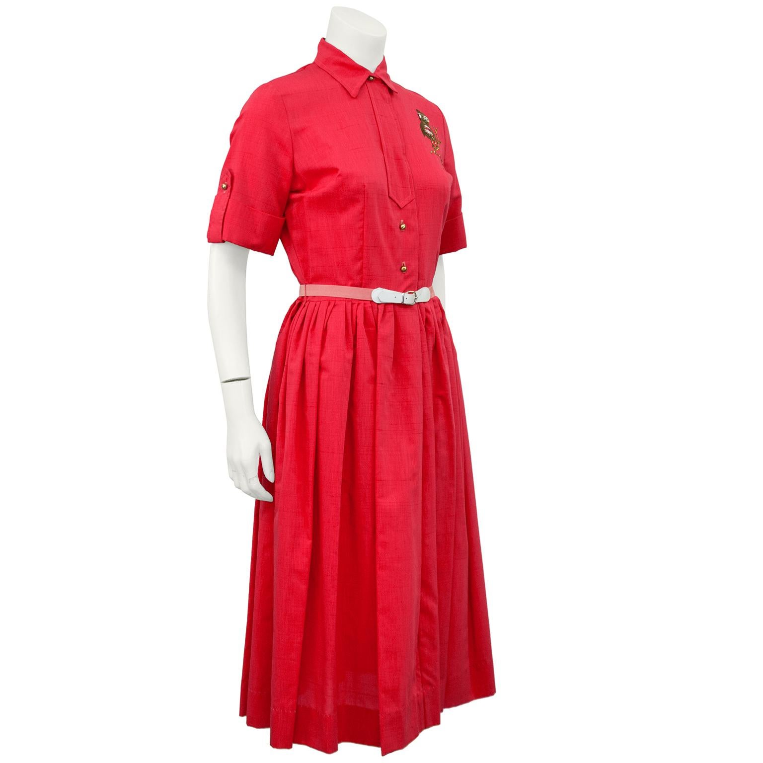 Adorable dead stock 1960s coral shirtdress with belt and gold ball buttons. Cuffs on the sleeves are finished with matching buttons and hidden snap behind front placket. Gathering at the natural waist creates an full line skirt and the blush elastic