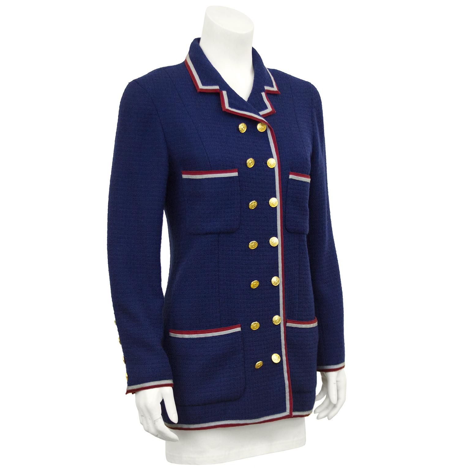 Collection 20 Chanel deep royal blue waffle wool double breasted jacket with red and grey grosgrain ribbon trim throughout. Shaped for a sleek slim look, long silhouette and dozens of gilt metal buttons on the front and sleeve cuffs. Fully lined in