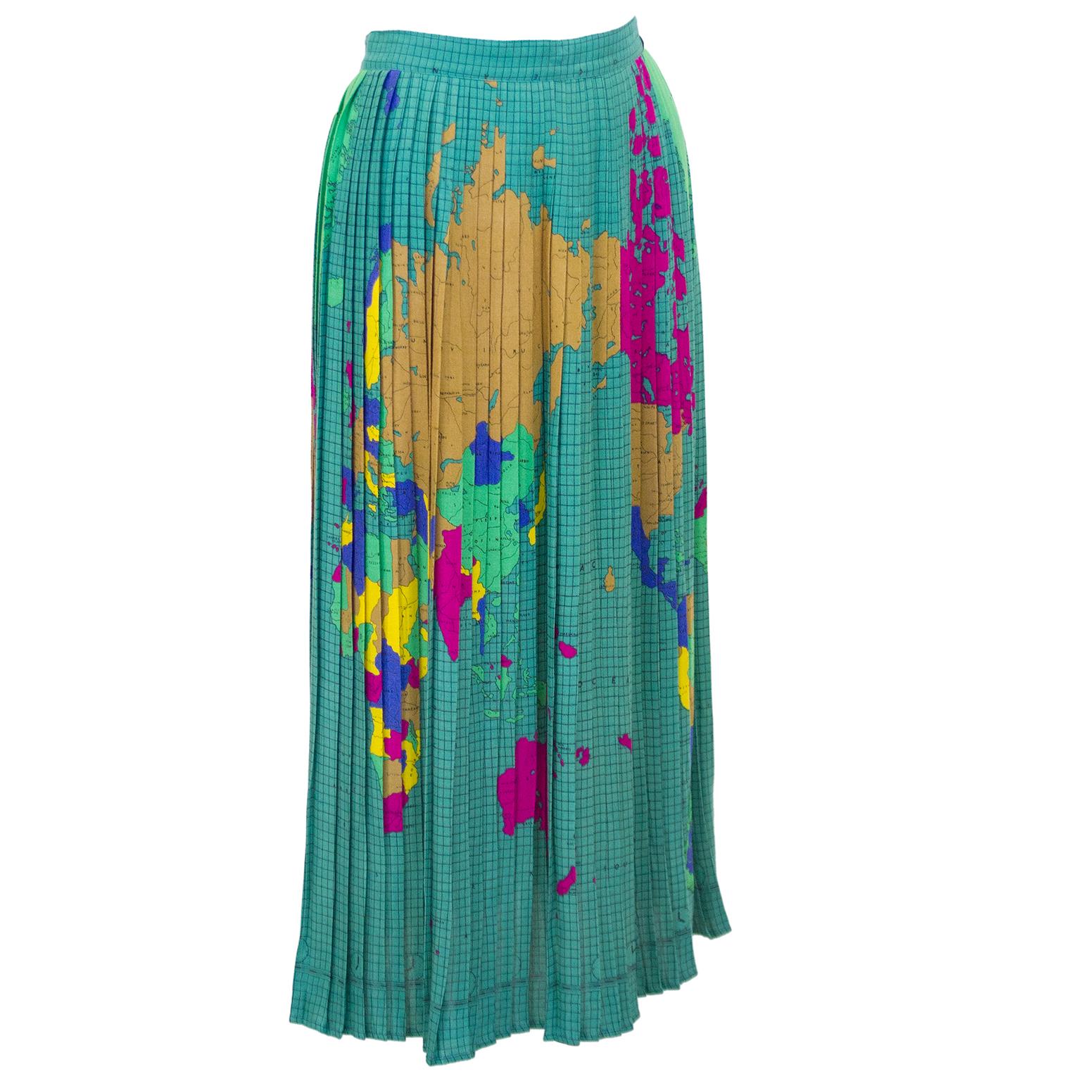 Unique and hard to find Fiorucci pleated skirt from the 1970s. The skirt features an allover pattern of the map of the world in vibrant jewel tones. Fastens in the back with a zipper and button on the waistband. Small fit US 2. Dry cleaned and ready