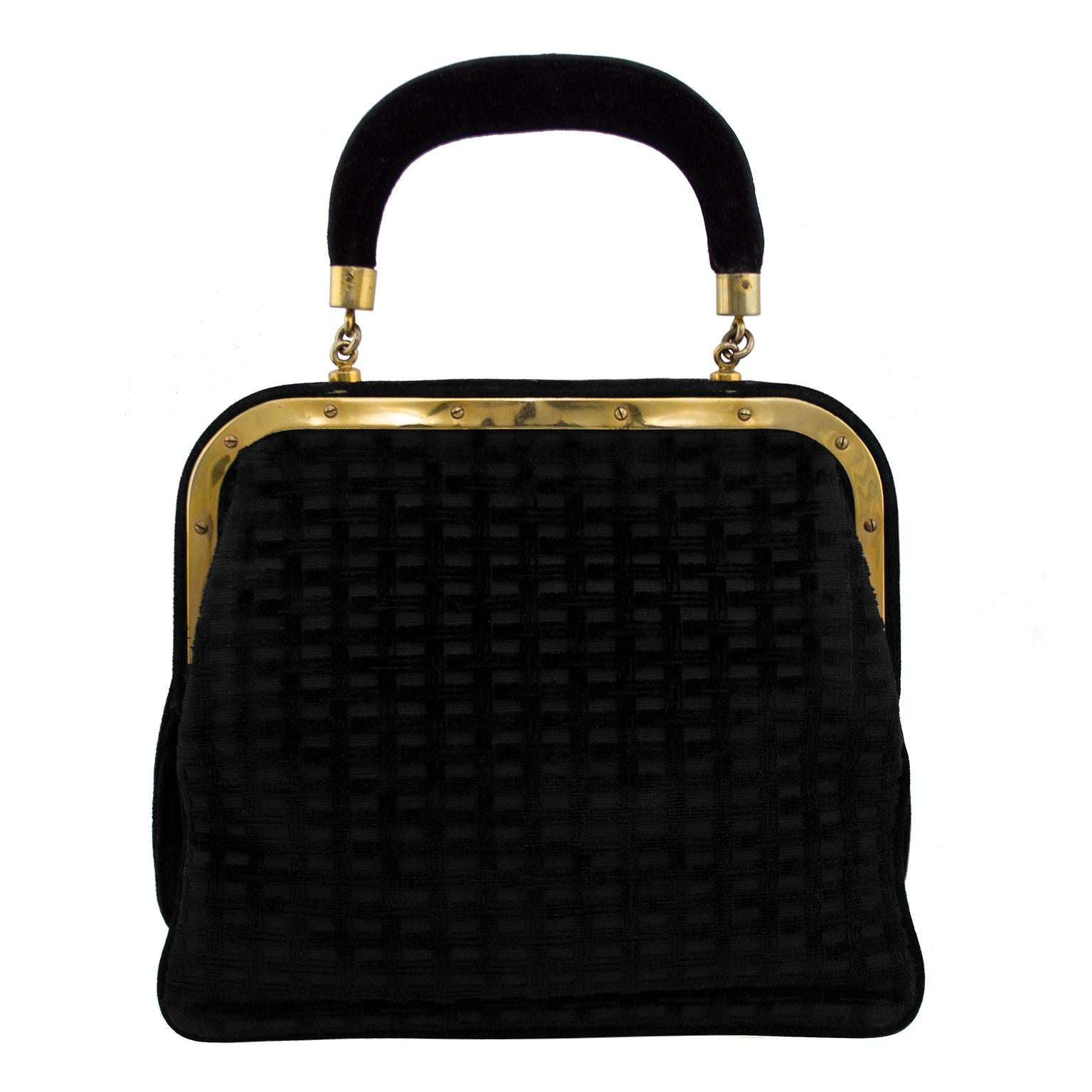 Classic style Roberta di Camerino top handle lady bag. The black textured velvet exterior is on a yellow gold frame that closes at the top with a turn ring. Lined in bright red leather, the interior is free of any stains and the bag has a unique