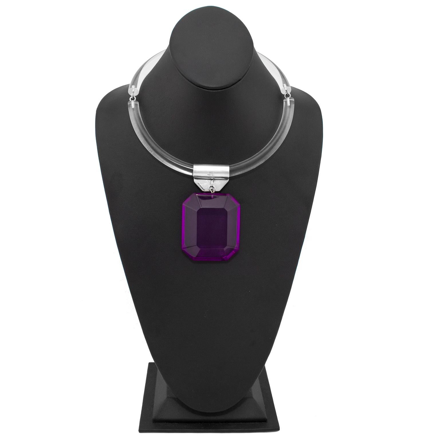 Fabulous 1980s Judith Hendler tube ring necklace with hanging purple acrylic pendant. The bright purple rectangular pendant is faceted on the sides and it hangs from a flat silver link. The necklace closes on the left side, the C-ring hooks into the
