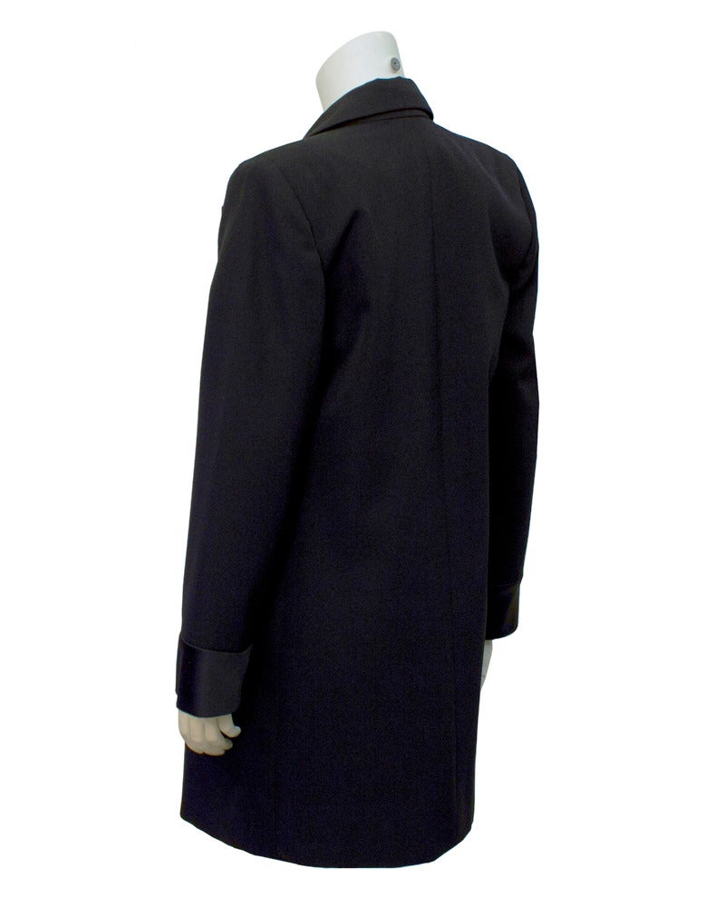 This YSL Le Smoking tuxedo jacket/mini dress is the most sought after collectors item. It is shown here in one of its early versions. This piece dates from the mid 80's, probably worn as a mini in its day, today it can double as a jacket over narrow