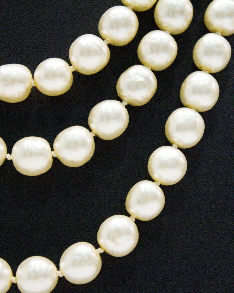 Contemporary 1980s Chanel Long Pearl Necklace with Red Stone Clasp