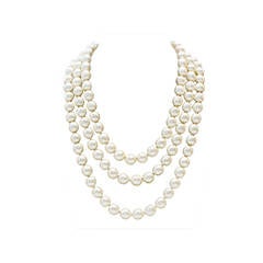 1980s Chanel Long Pearl Necklace with Red Stone Clasp