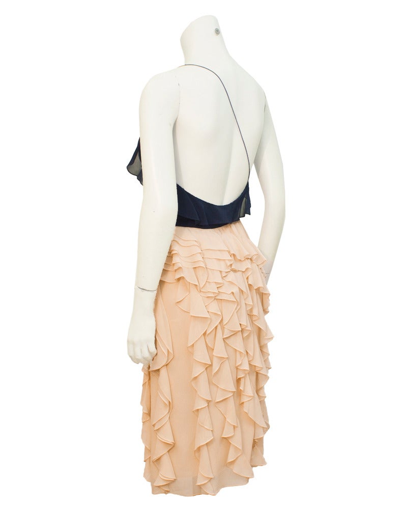 Feminine color block chiffon cocktail dress with one shoulder and cascading ruffles. Simple and elegant from early 1980's Bill Blass collection. Delicate navy chiffon strap crosses the shoulder blades to keep the top in place. Very good condition.