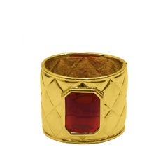 Late 1980s Les Bernard Gold Quilted Cuff with Red Poured Glass Stone