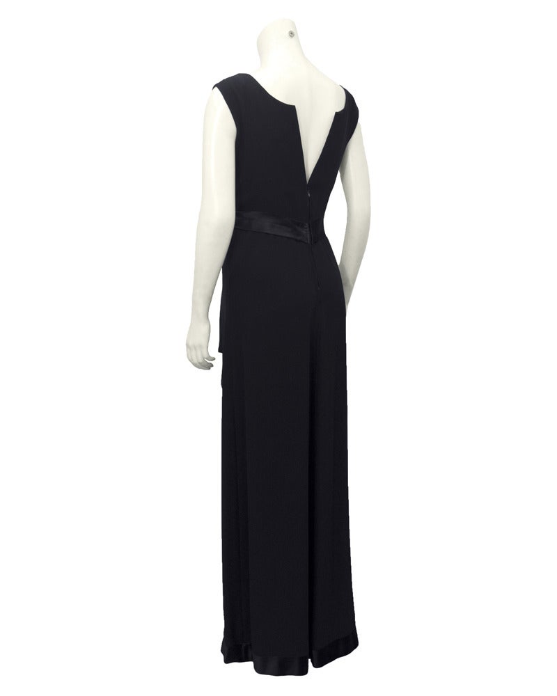 It's all in the details! This gorgeous black Jean Patou gown from the 1960s shows that the right combination of materials and exquisite workmanship can make the perfect LBG (little black gown). The cap sleeves of the gown give some coverage while