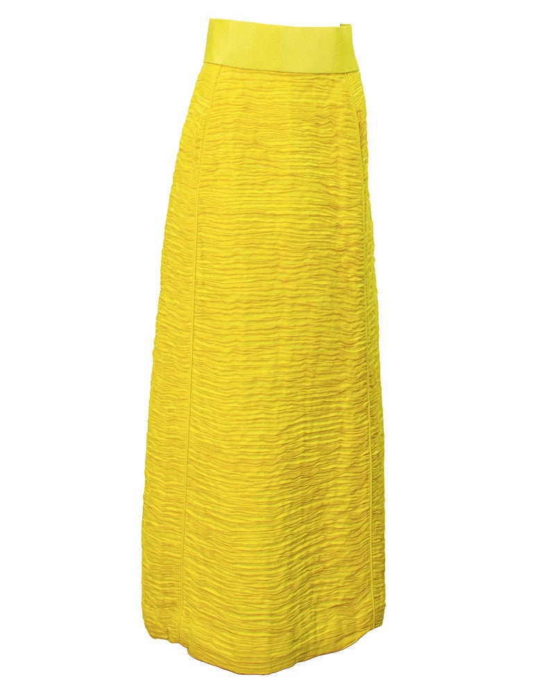This 1960's yellow skirt is iconic Sybil Connolly. Her trademark was pleated linen, a labour intensive process, where up to nine yards of fine Irish handkerchief linen was hand pleated resulting in one yard of exquisite fabric. The pleats were set