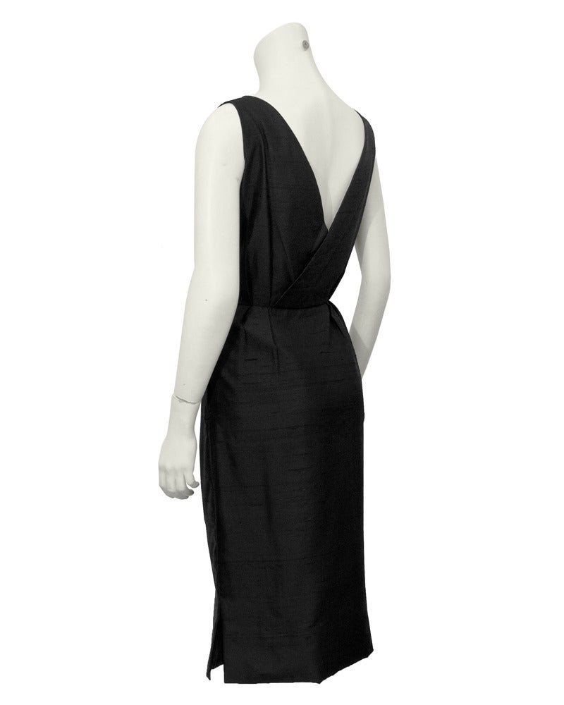 Extremely sexy architectural silk dress by English designer Frederick Starke. Made in the 1960's though it looks much like Prada's recent collections. Deep V detail in the front and back add to the linear appeal of this elegant piece. Excellent