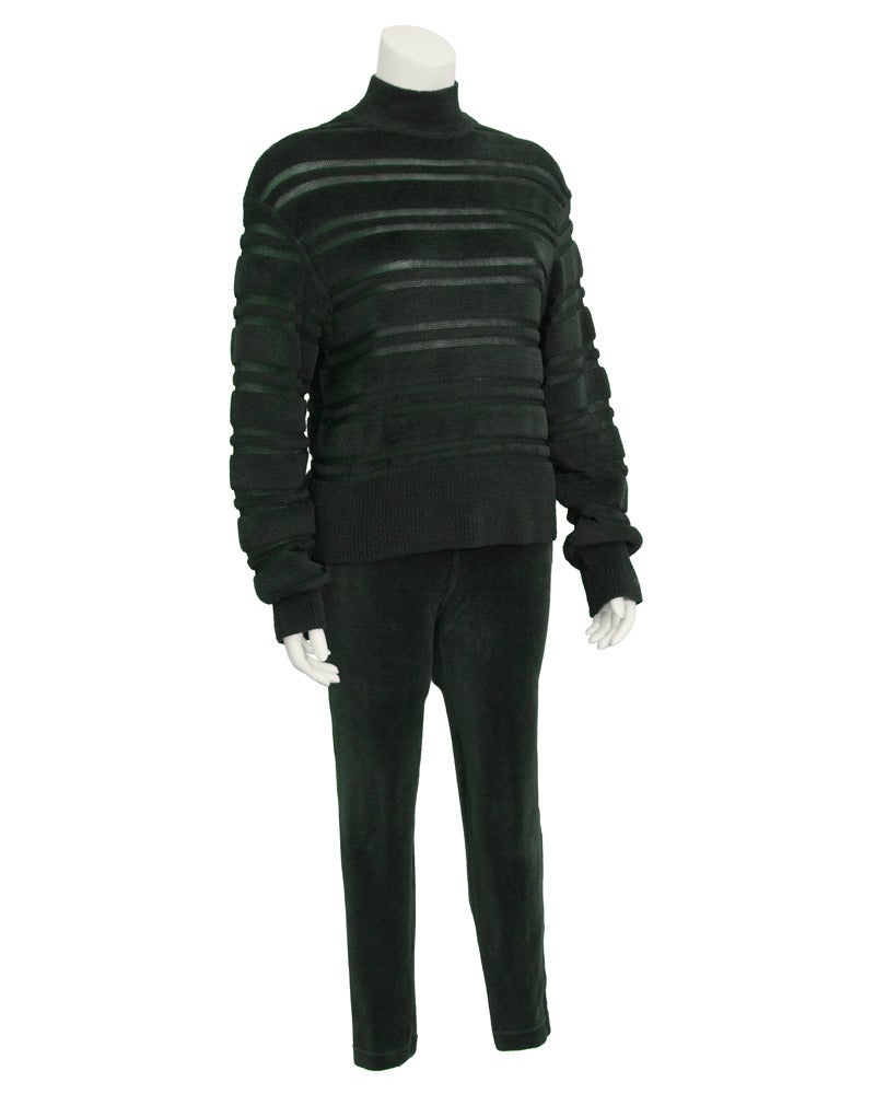 Green Alaia oversized turtleneck and leggings set from the 1990's. Rayon and polyester turtleneck is ribbed with a transparent knit stripes. Leggings are fitted and cropped with netting at the hips. Cozy for the colder months, perfect apres ski
