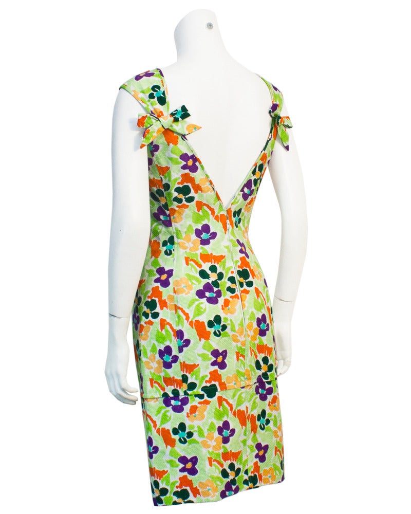 Sexy cotton floral Ungaro cocktail dress/day dress in pique with vibrant green, orange and purple flowels. Fresh enough for a visit to a tropical wedding, perfect for a cruise or just a great addition to your wardrobe. Circa 1980. Excellent vintage