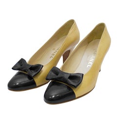 1980's Chanel Beige Leather Pumps with Black Toe Cap & Bow
