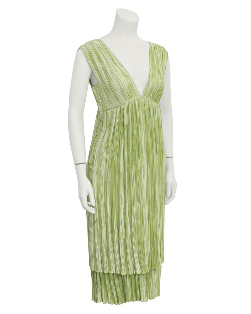 Great 1980's Mary McFadden ice mint green silk dress and bolero set. The entire dress is comprised of two layers of the iconic Mary McFadden 'Marii' micro pleats. Deep V front and back and empire waist. The matching silk horizontal channel quilted