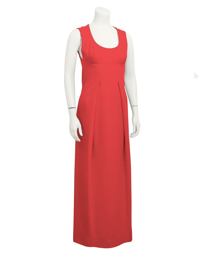 1970's Pauline Trigere red knit jersey gown and jacket ensemble. Gown is empire waist with inverted pleats in the front. Skims the body beautifully, lined in red silk. The long line jacket gives the option of a more conservative look, hitting below