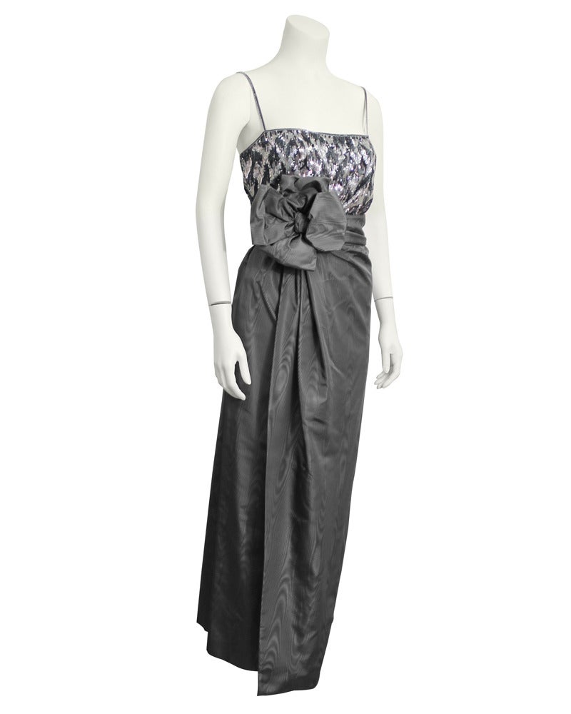 Beautiful slate grey four piece Christian Dior Couture moire silk and sequin ensemble from the Autumn/Winter 1979 collection. Spaghetti strap top with tone on tone grey hand beading and sequins. Top tucks into a tea length grey silk moire wrap