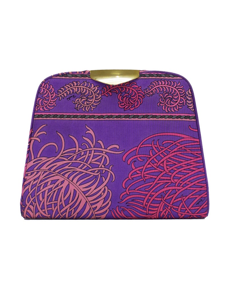 1960's matching silk dinner size clutch and silk scarf set. Both items use signed fabric with prints of pink feathers and grey arrows on a purple background. Clutch has gold tone metal detailing at clasp, simply pulls apart to open and has a black