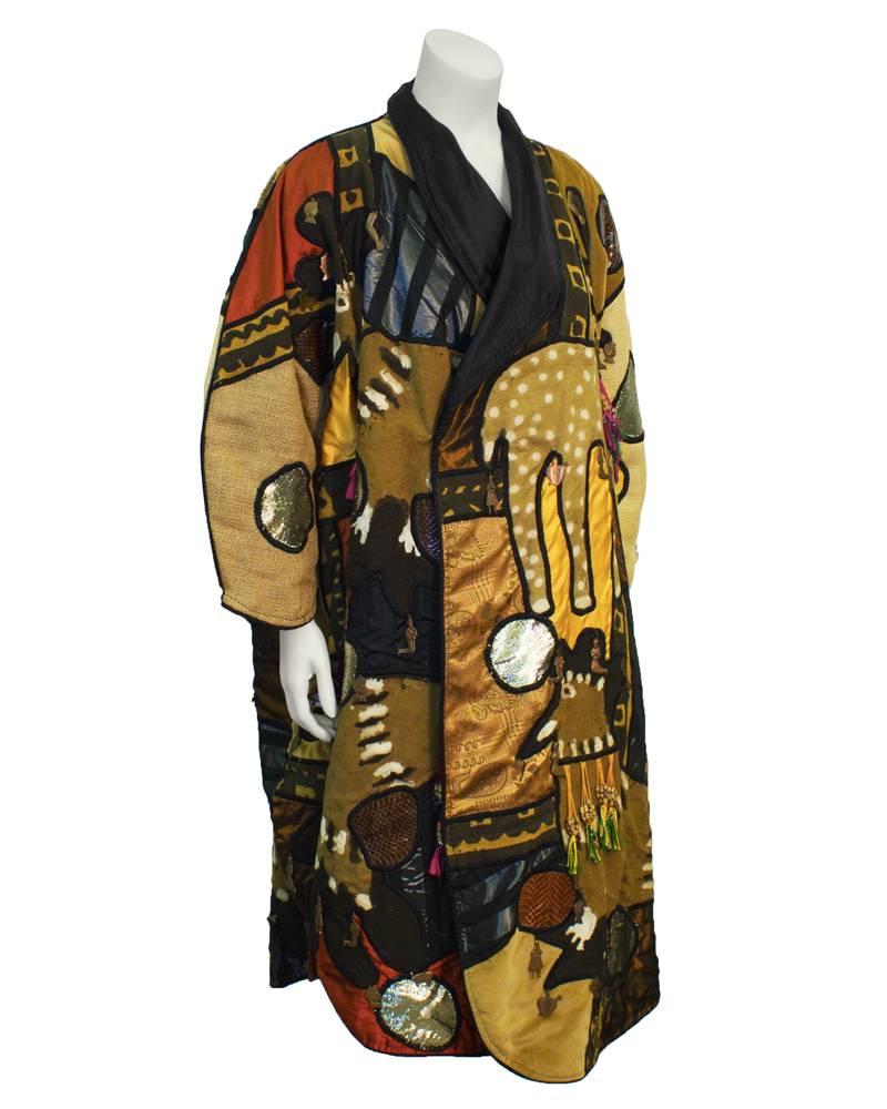Art-to-Wear 1970's vintage hand decorated multi fabric Mexican themed coat. Very collectable as art or fashion. In unworn vintage condition. Unstructured and forgiving in fit. A great conversation piece.
