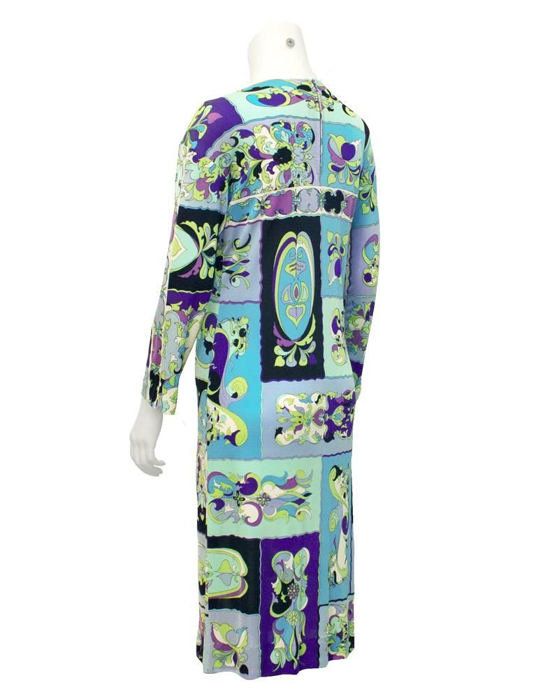 Classic silk jersey dress from the 60's, a combination of blue, green and black Pucci print. Looks great for all seasons. Zipper up the back of the neck. In excellent vintage condition.