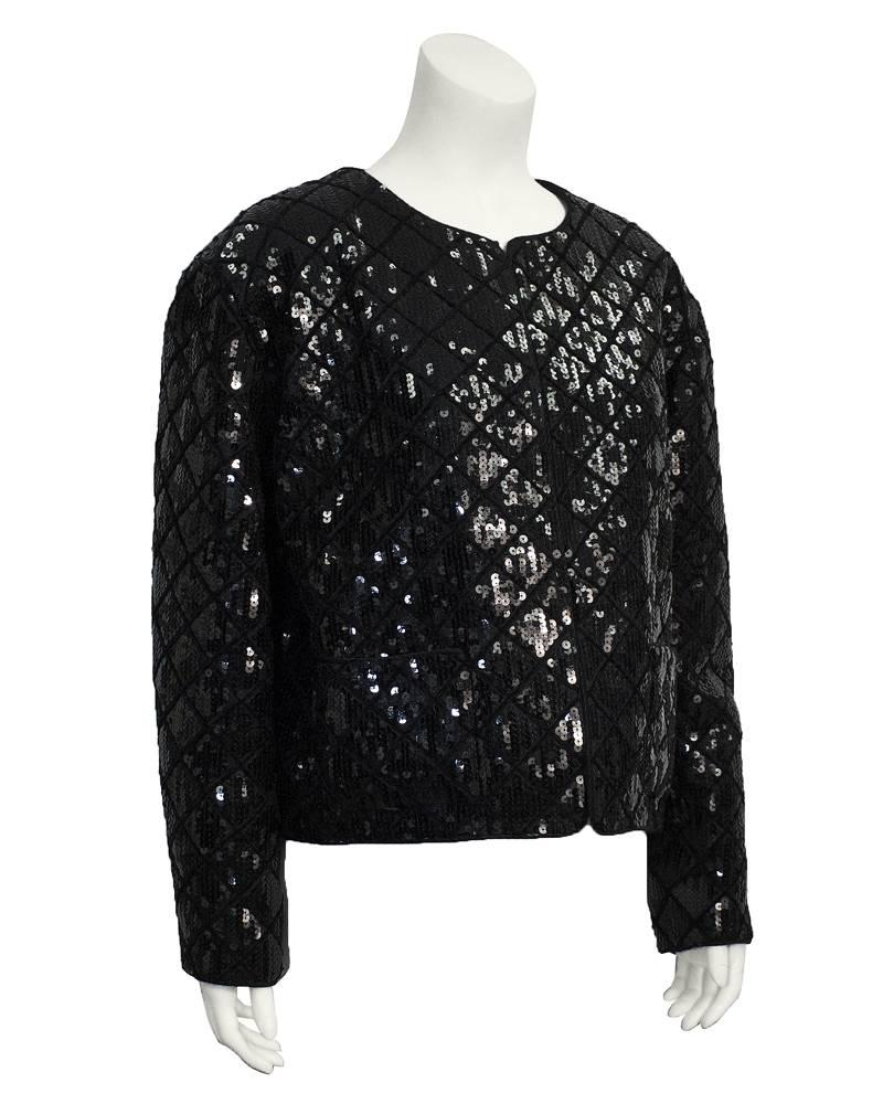 1990's Chanel black sequin matelasse jacket with a diamond pattern throughout. Open front, flat front pockets. The perfect jacket with jeans and stilettos for dinner and drinks. Excellent vintage condition. 