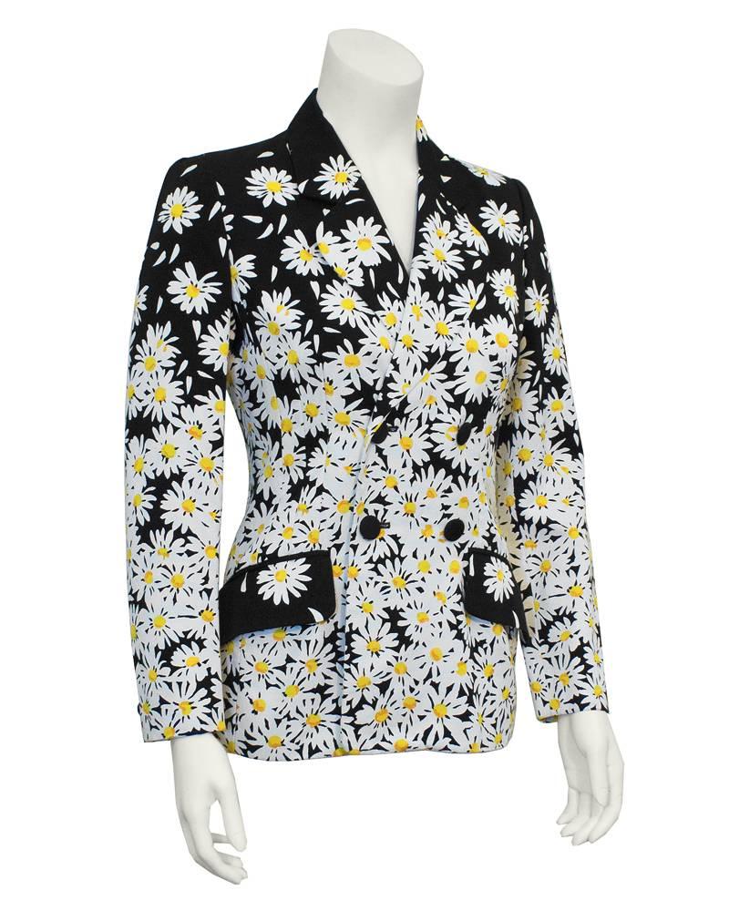 1990's Moschino Cheap and Chic navy blue gabardine blazer with a fun white and yellow daisy allover print. Fitted, double breasted with navy fabric covered buttons and front pockets. Excellent vintage condition. 