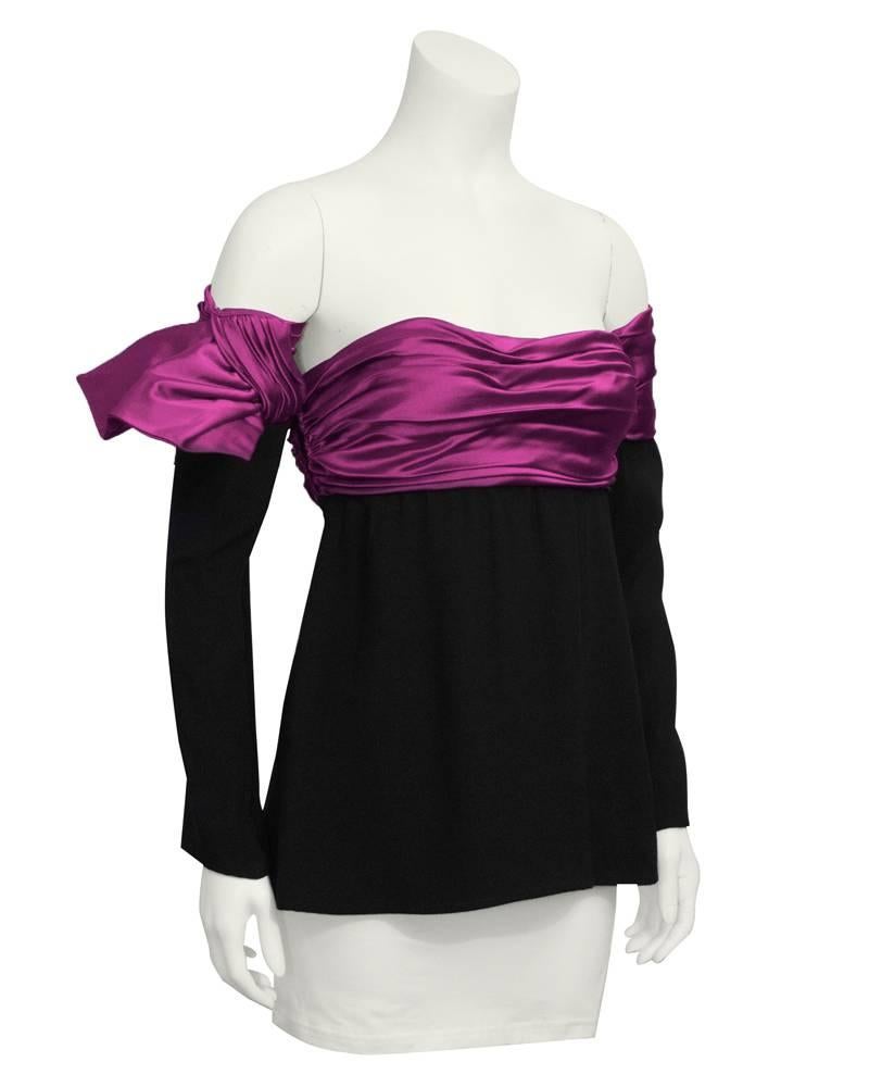 1980's Lanvin strapless top with optional sleeves. The bright fushia banding along the bust line continues onto the upper part of the sleeves, giving the illusion that they are one piece. Can be worn separately. The sleeves slide on. In excellent