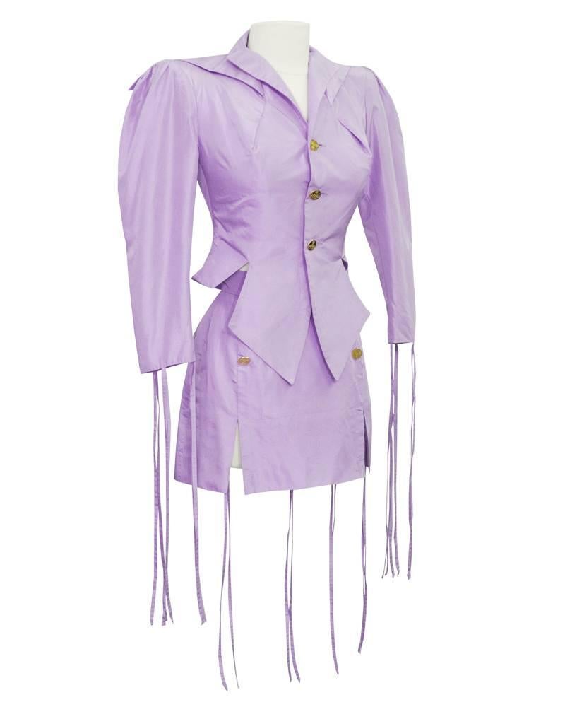 1980s Vivienne Westwood lilac garter style jacket and skirt ensemble bought at auction as part of the the personal archives of Vivienne Westwood. This suit is definitely a rare find. Avant-garde with very large and exaggerated shoulder pads and gold