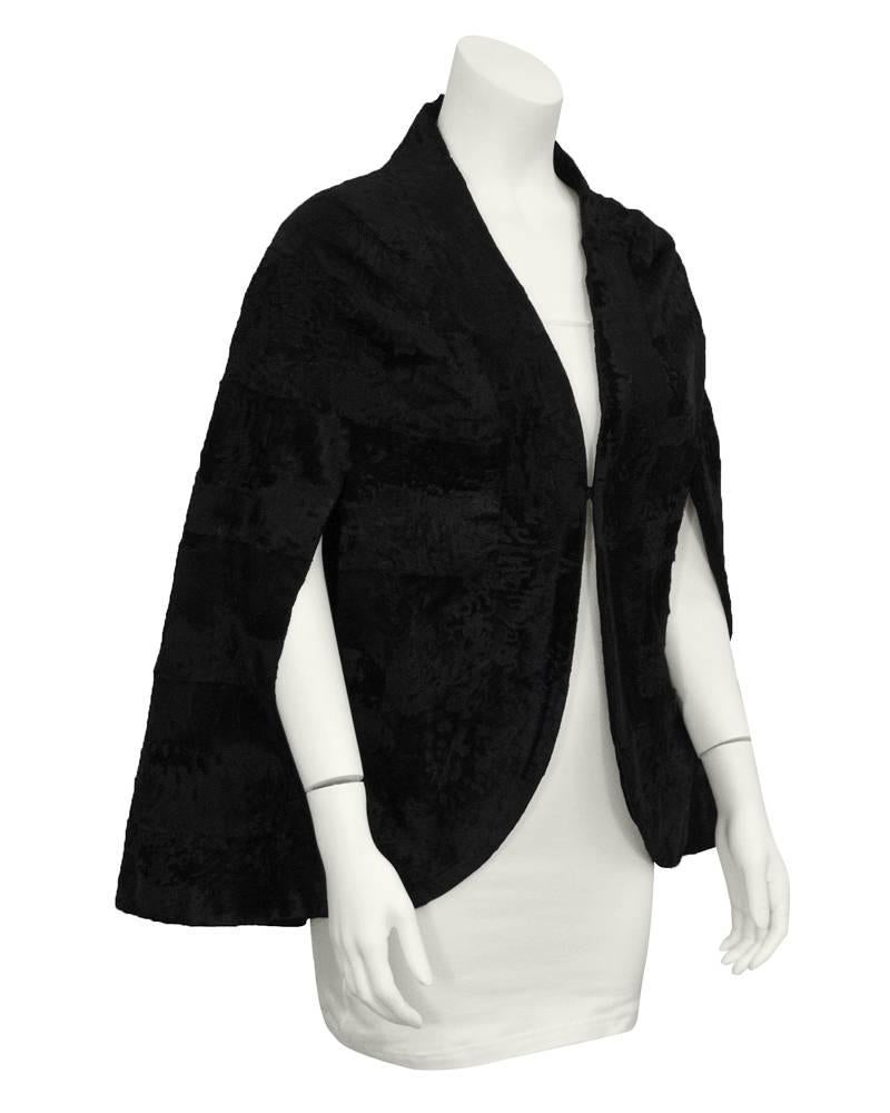 Great black broadtail cape. Large hook and eye closure at bust. Perfect for fall and winter with a cashmere knit underneath. In excellent vintage condition, very light usage. 