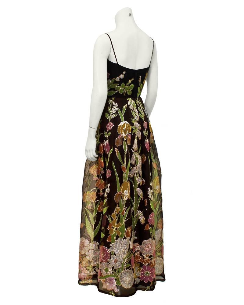 1970's brown silk chiffon with colorful all over floral embroidery and gold thread tambour stitching for a little bit of sparkle from Canadian demi couture designer Maggie Reeves. Classic slip shape  with gathered skirt in good vintage condition -