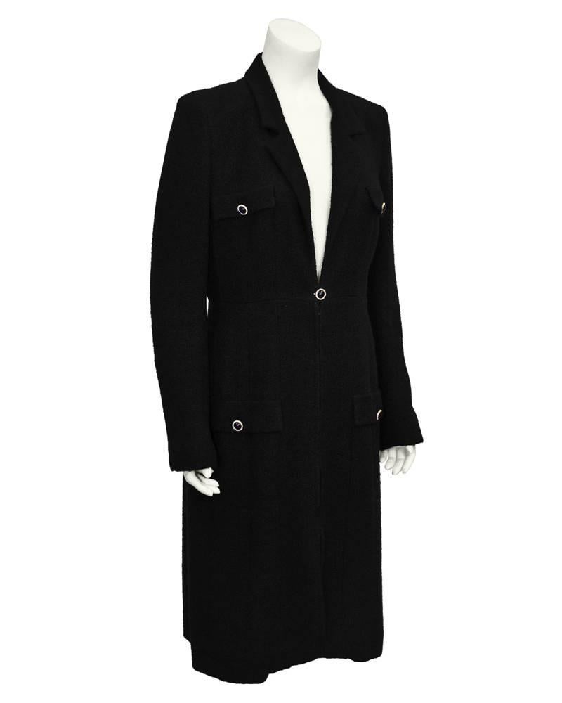 Spring 2002 charcoal black wool Chanel coat dress. Gold buttons with black resin trimmed in tiny pearls. Deep v and zipper front. Can be worn open as a jacket or zipped with a crisp white shirt underneath. Fits like a US 6-8.
