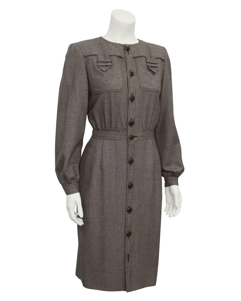1980's Valentino brown tweed wool button front long sleeve shirt dress. Cinched waist, brown wood buttons and details at bust. Missing bottom button. Excellent vintage condition. Fits like a US 4-6.

FR 42/US 8