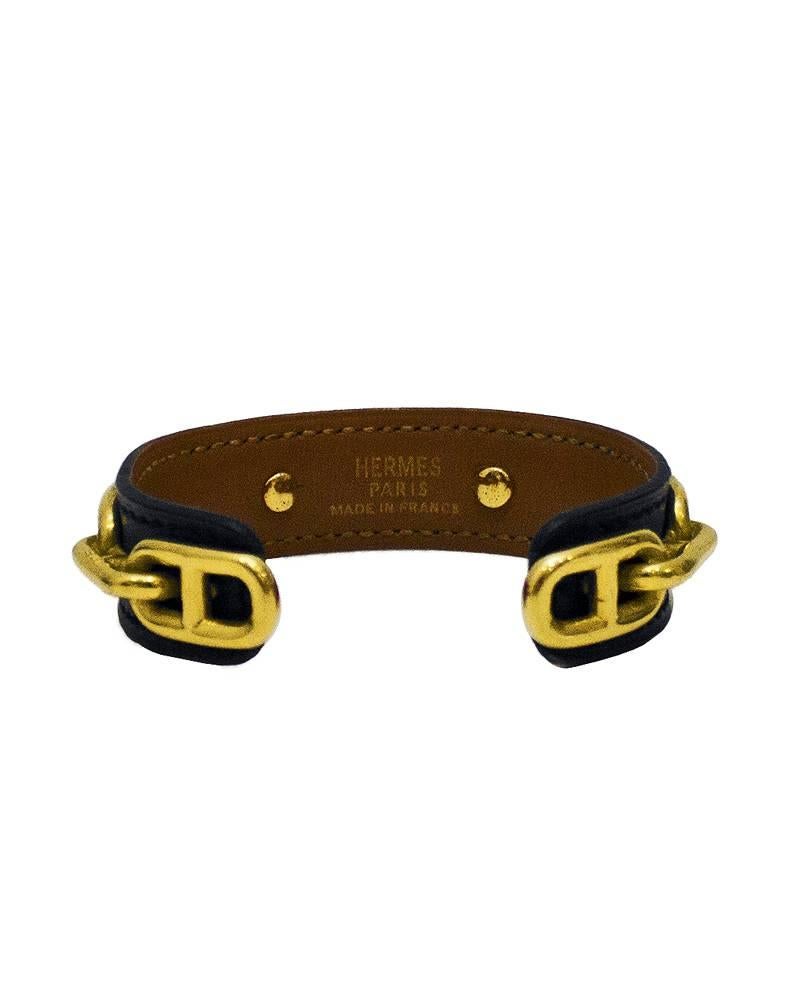 Leather Hermès Chaîne d'Ancre cuff bracelet with gold-plated Chaîne d'Ancre links. Leather is navy blue with a dark tan interior. Excellent vintage condition. S-M fit.

