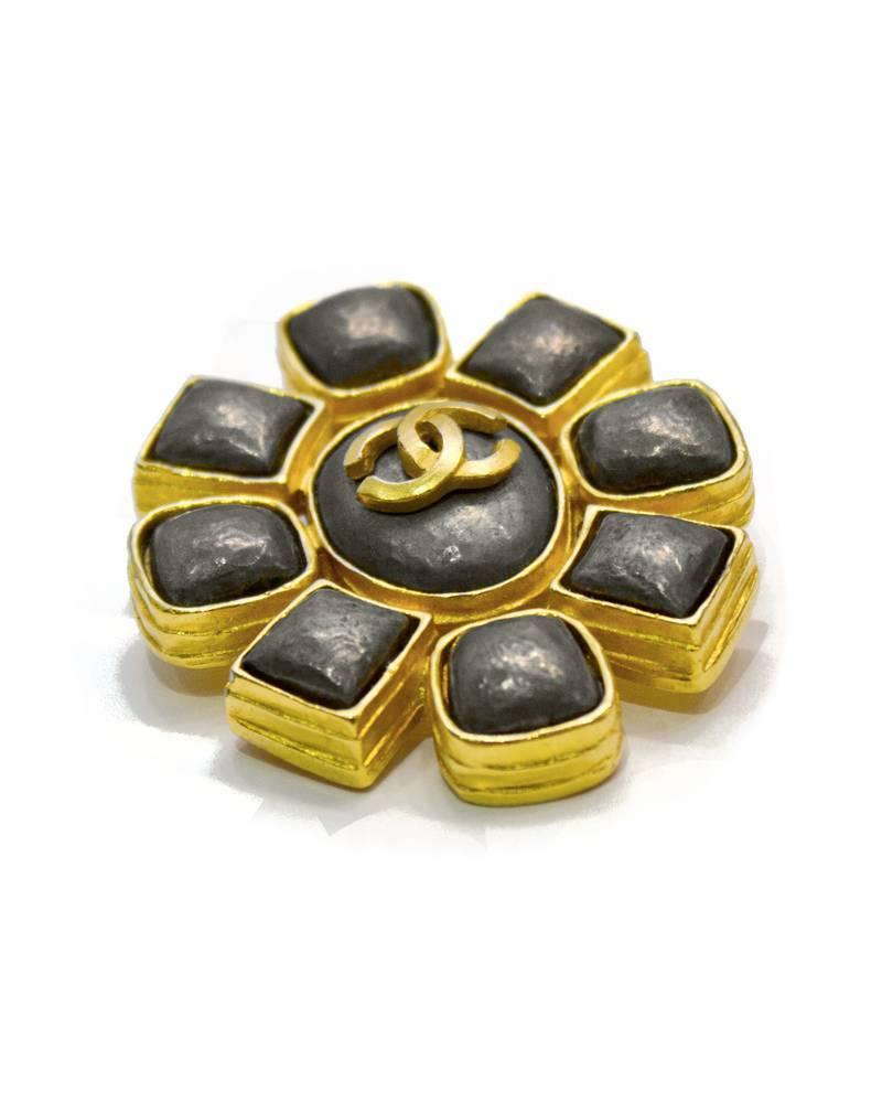 Elegant Chanel faux pewter and gold stylized floral pin from the Autumn 1997 collection. Daisy shaped with gold CC logo at center. Gold has a matte finish. Excellent vintage condition. 