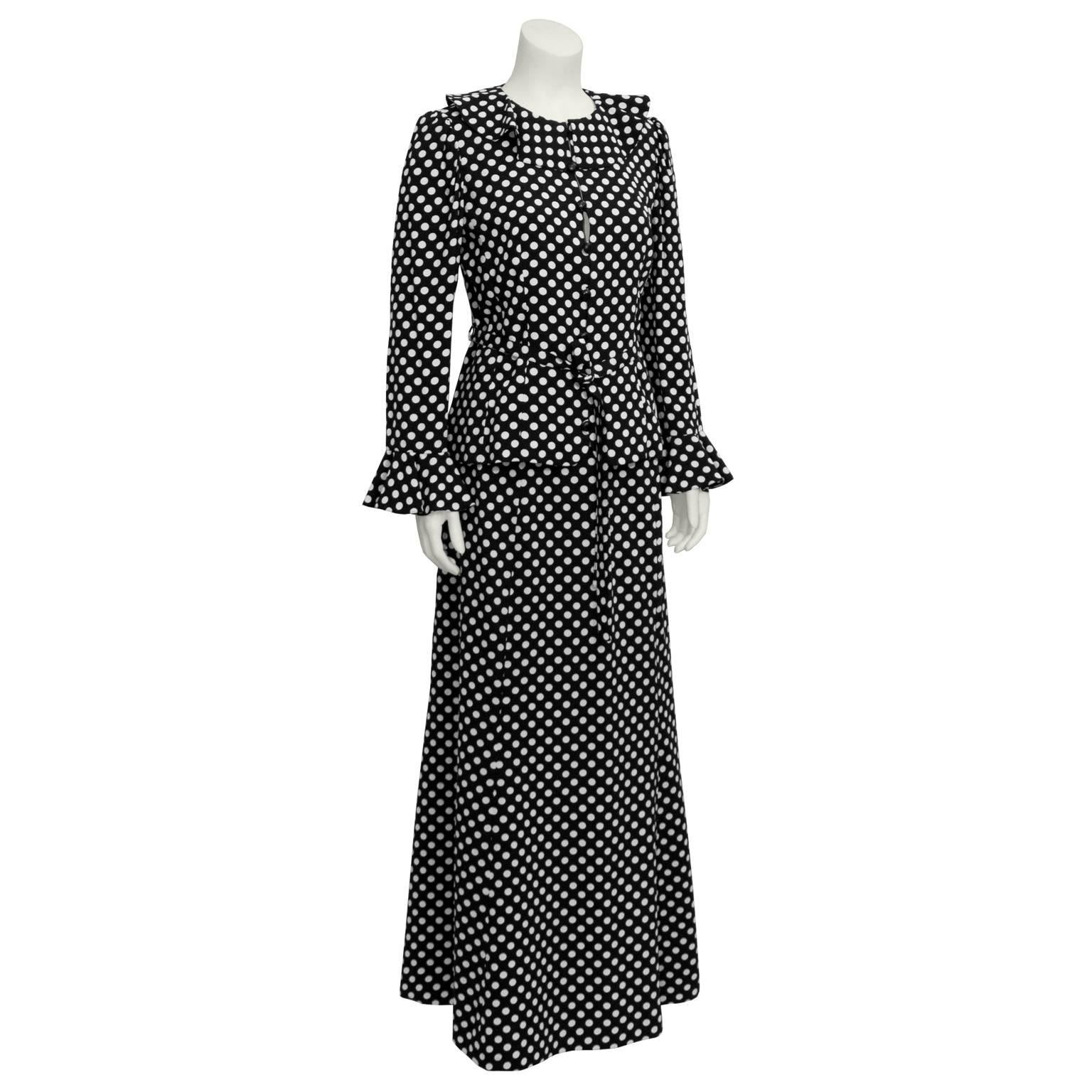 A fabulous moss crepe polka dot long skirt ensemble from Yves Saint Laurent dating from the 1970's. Swallowtail blazer has a ruffled Peter Pan collar with cascading ends. Button closure down center with a waist belt. Shoulders are slightly puffed,