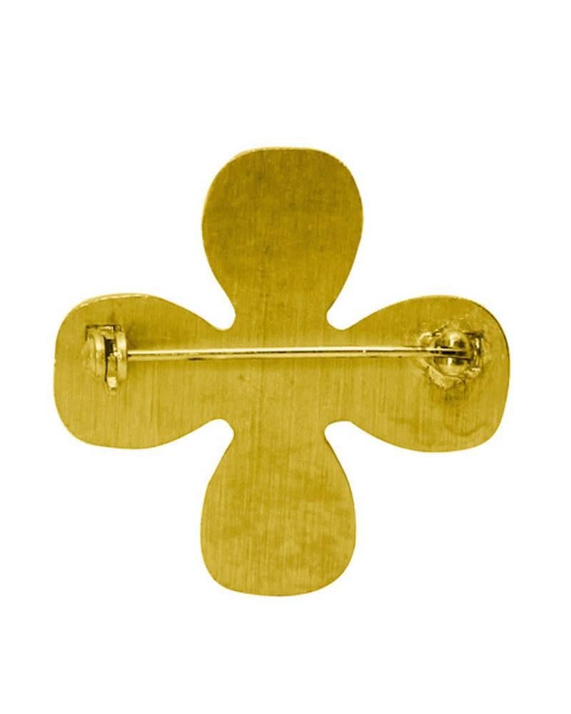 Gold-tone Chanel pin in the shape of a four leaf clover. Details include 2 rows of set rhinestones on all four leaves of the clover and Chanel's CC logo in the center. From a collector in Japan. Horizontal pin and safety closure, good vintage