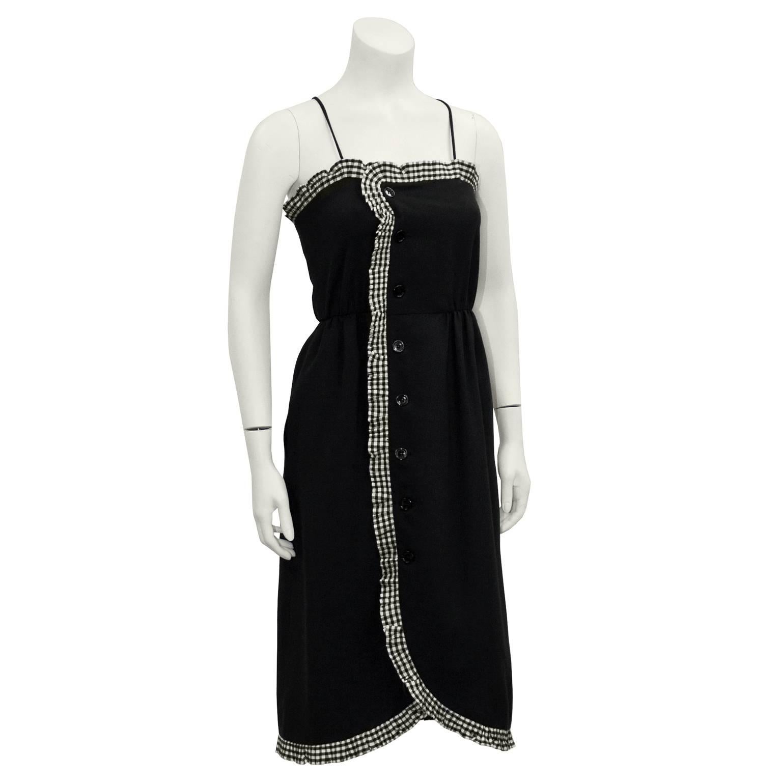 Adorable early 1980's Victor Costa black cotton wrap dress with a black and white gingham ruffle trim. Features camisole neckline with spaghetti straps. Cinched at waist. Button closure down front left with black buttons. Excellent vintage