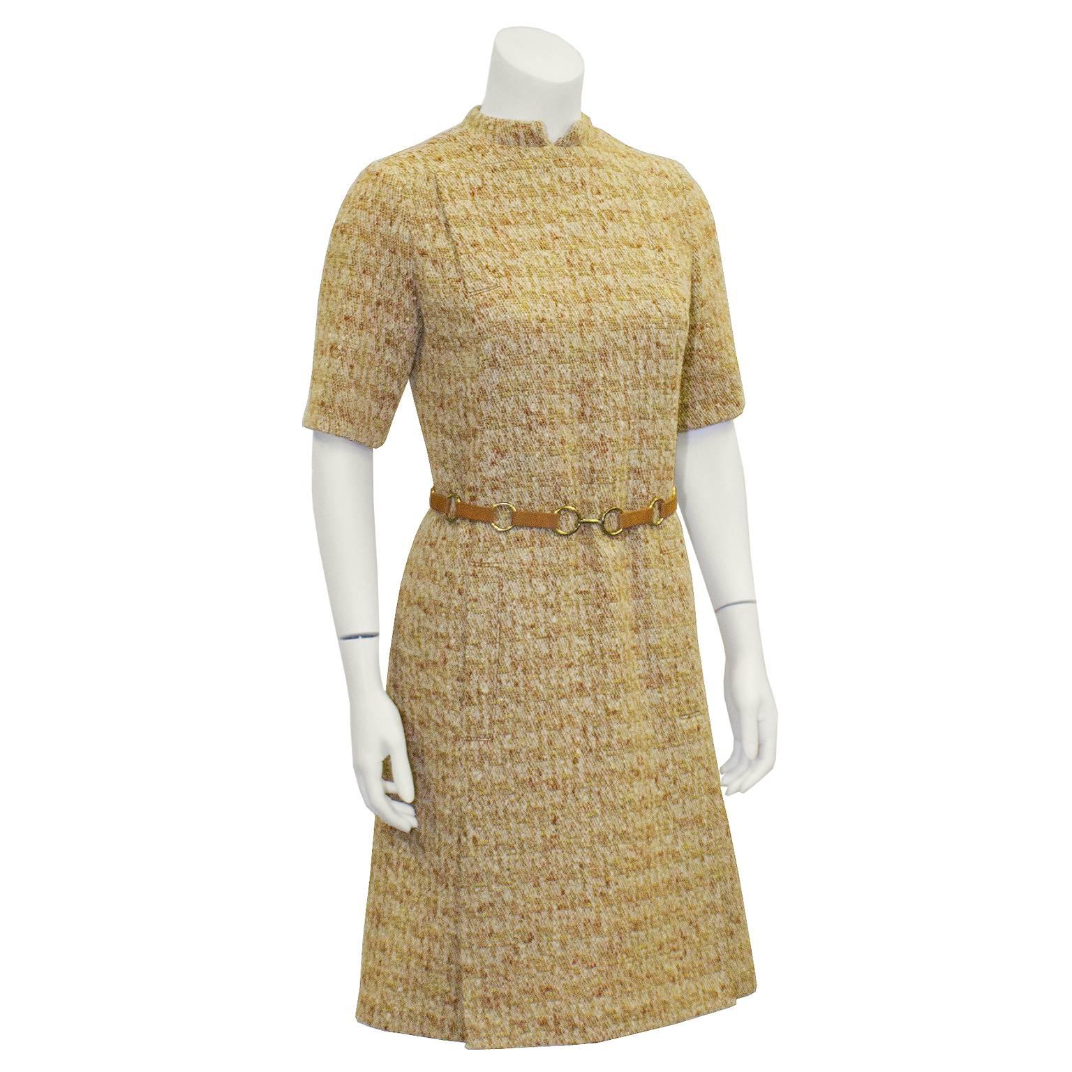 MOD era 1960's Swiss crafted from French fabric A-Line dress . Band collar, short sleeves and a fabulous suede and gold plated round link belt at the waist. Two inverted kick pleats on skirt. Back zip closure. Tweed has notes of orange, yellow and