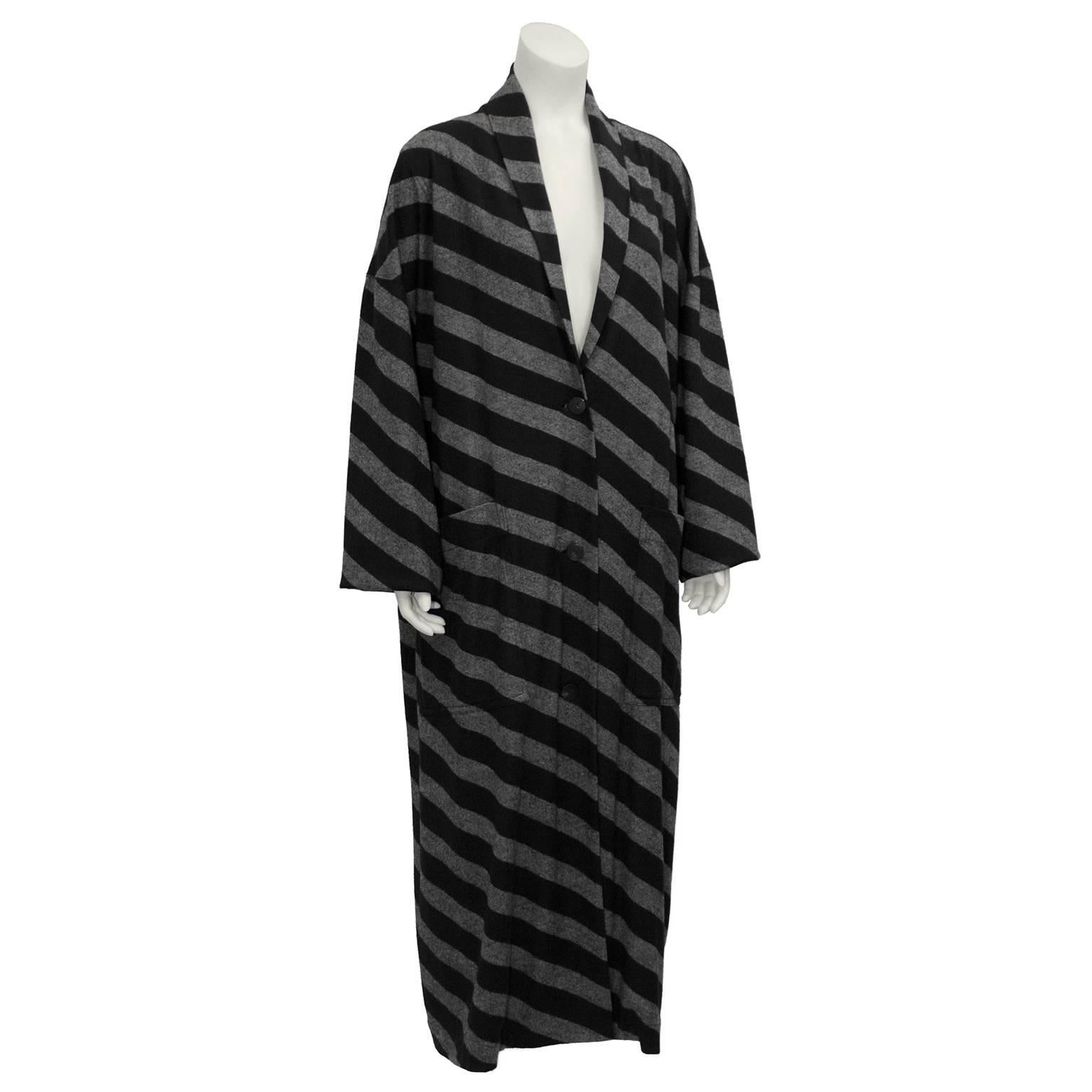 This amazing set by Issey Miyake for his Plantation line dates from the 1980's.   Floor length loose fit robe style coat has a deep shawl collar, front button closure, and two large pockets at the hips. Long sleeves are loose and wide. Floor length