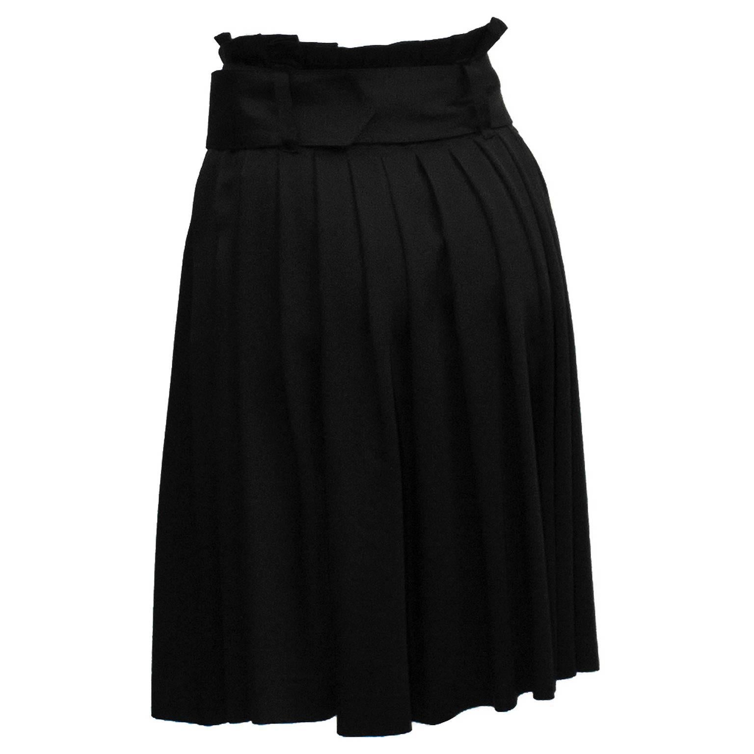Alexander Mcqueen black pleated paperbag style sateen skirt from the 2000's. Skirt features a wide belt of the same sateen blend fabric. Double-d ring belt has gold tone hardware. Side zip and hook closure. Excellent condition.  Fits like a US size