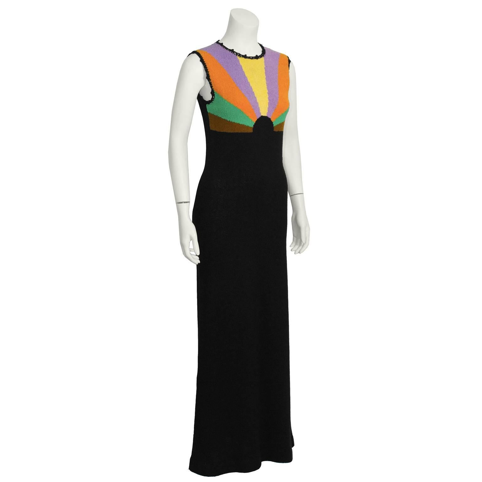 Slinky knit Puccini dress from the 1970's. Simple sheath cut, with a bright color rainbow design on bodice in yellow, purple, orange, green and brown. Back zip closure. Excellent vintage condition. Fits like a US 6. 