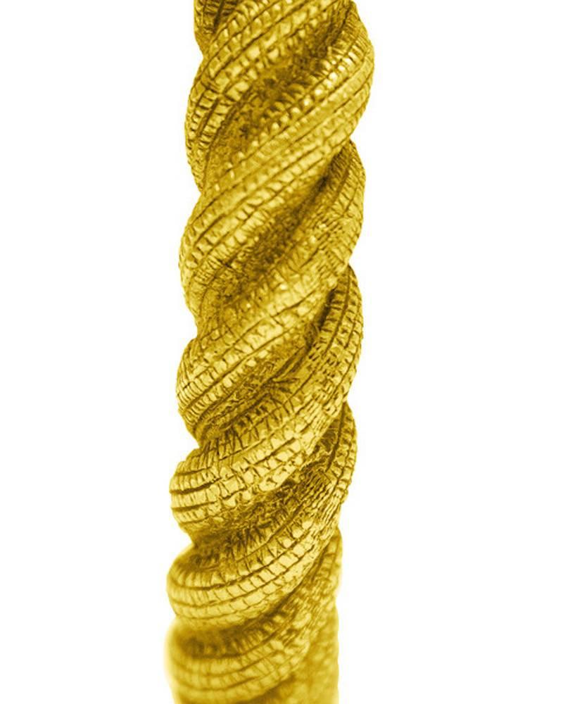 Chanel rigid gold twisted rope bangle from collection 25 in the early 1980's. The bangle has a nice weight to it and is large enough to fit several sizes. In excellent condition with a vintage patina. Can be worn above the elbow.