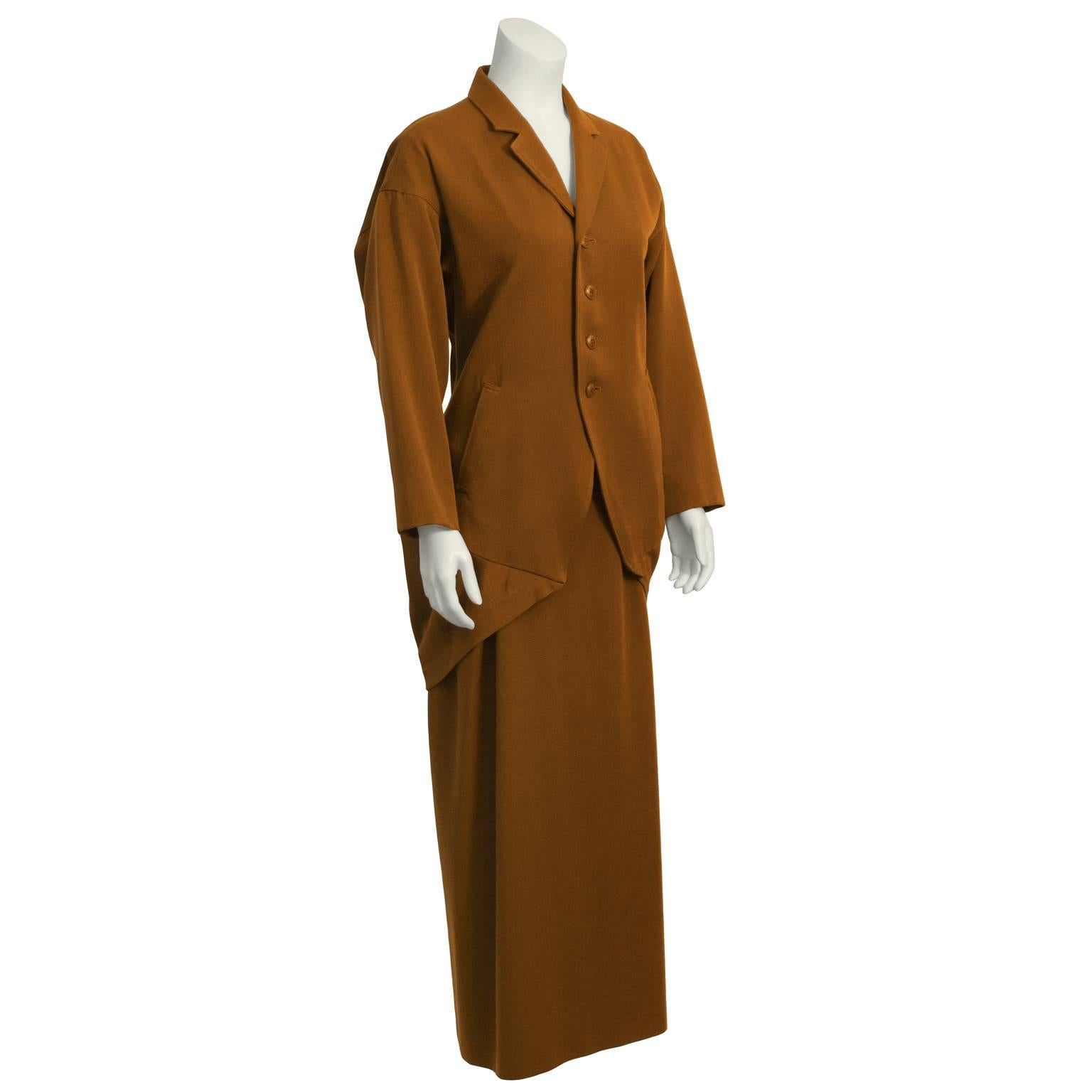 Chic and unusual early Issey Miyake hazelnut brown jacket and skirt duo. Jacket has notched lapels, fitted waist, with loose sleeves. Tucked and ribbed fabric at the back creates interesting origami shape, a signature of the Japanese designer. Front