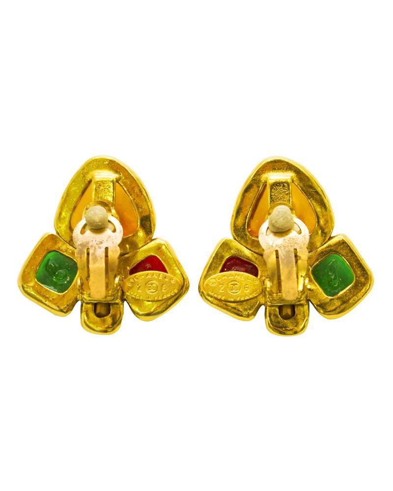 Chanel clip-on gripoix earrings with yellow, red, black and green poured glass stones set in gold-plated metal. Chanel markings on the backs show the earrings are from the collection 28; the mid 1980's. The colour patterns on the poured glass are