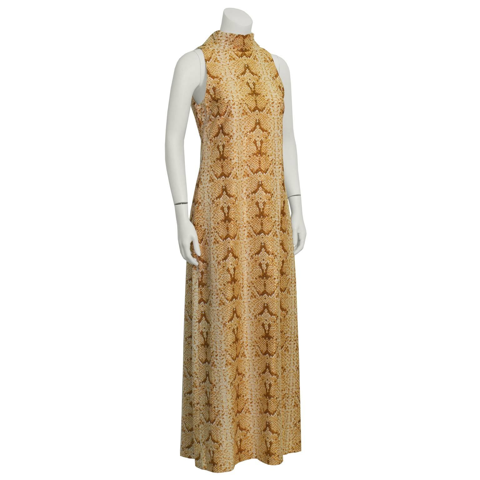 This anonymous 1970's mock turtleneck maxi dress is exotic and alluring with its copper metallic python print and gold lurex threading. Straight cut sleeveless maxi, with a folded neck and back zip closure. Excellent vintage condition. Just add sexy