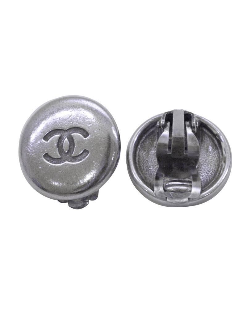 Vintage Chanel silver-tone clip-on earrings from the Spring 1996 collection. The Chanel CC logo engraved in the center of the circular earrings and Chanel markings on the backs. In good vintage condition. Nothing says chic like a cute Chanel button