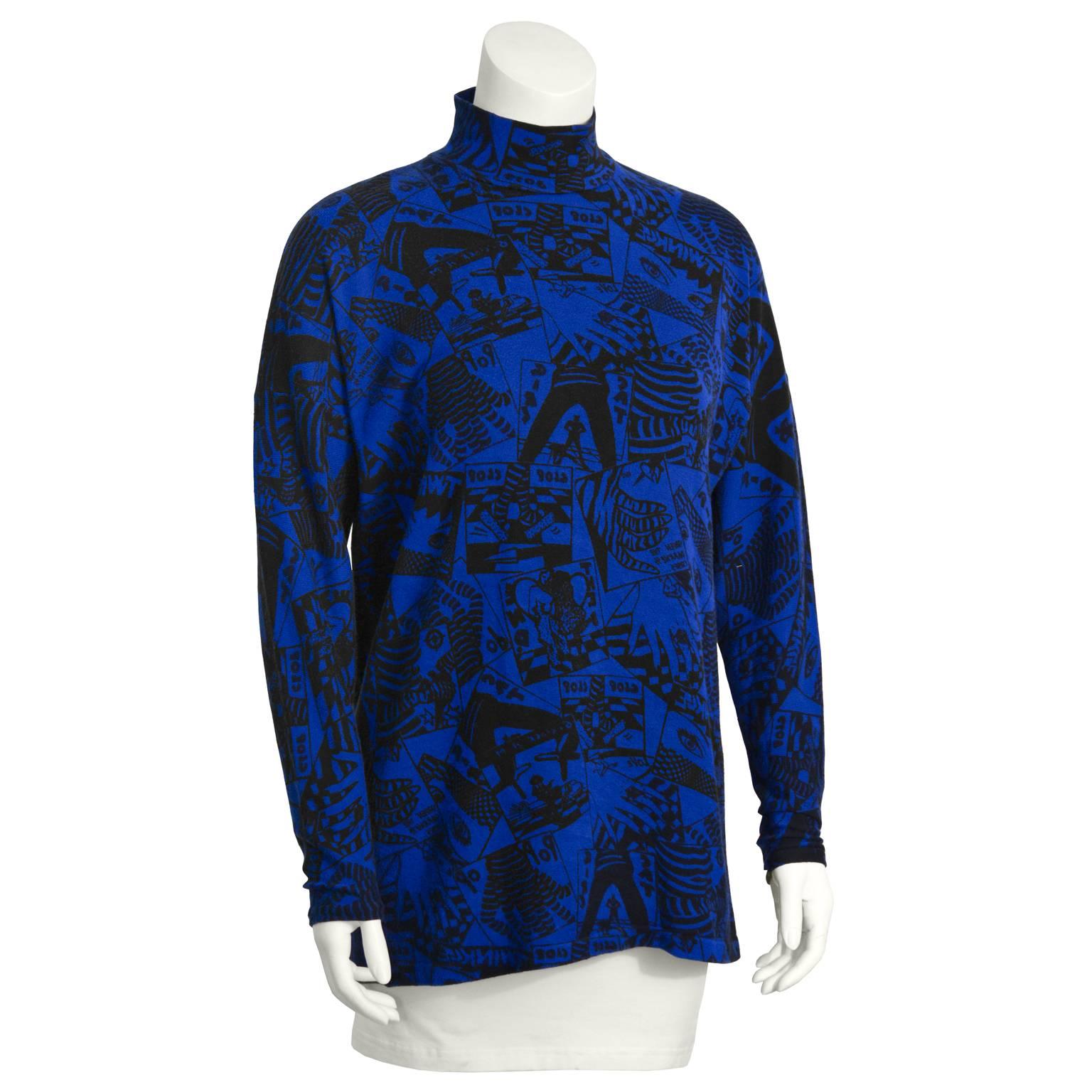 This funky Fiorruci sweater from the early1980s features an allover comic inspired print in vibrant blue and black. Button neck with silver snap buttons. Excellent vintage condition. A must have street look from an Italian label that went global