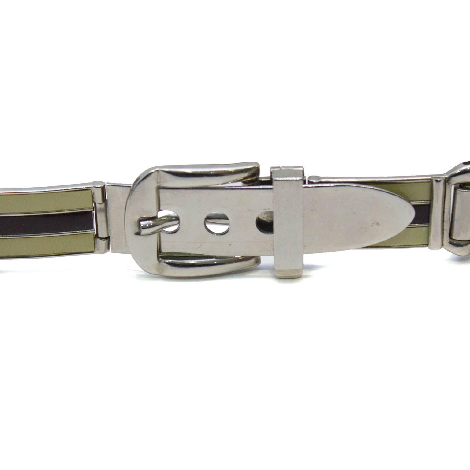 Unique Gucci silver metal belt from the 1970s features cream and brown enamel pattern on each link, and a silver metal buckle. Excellent vintage condition. 