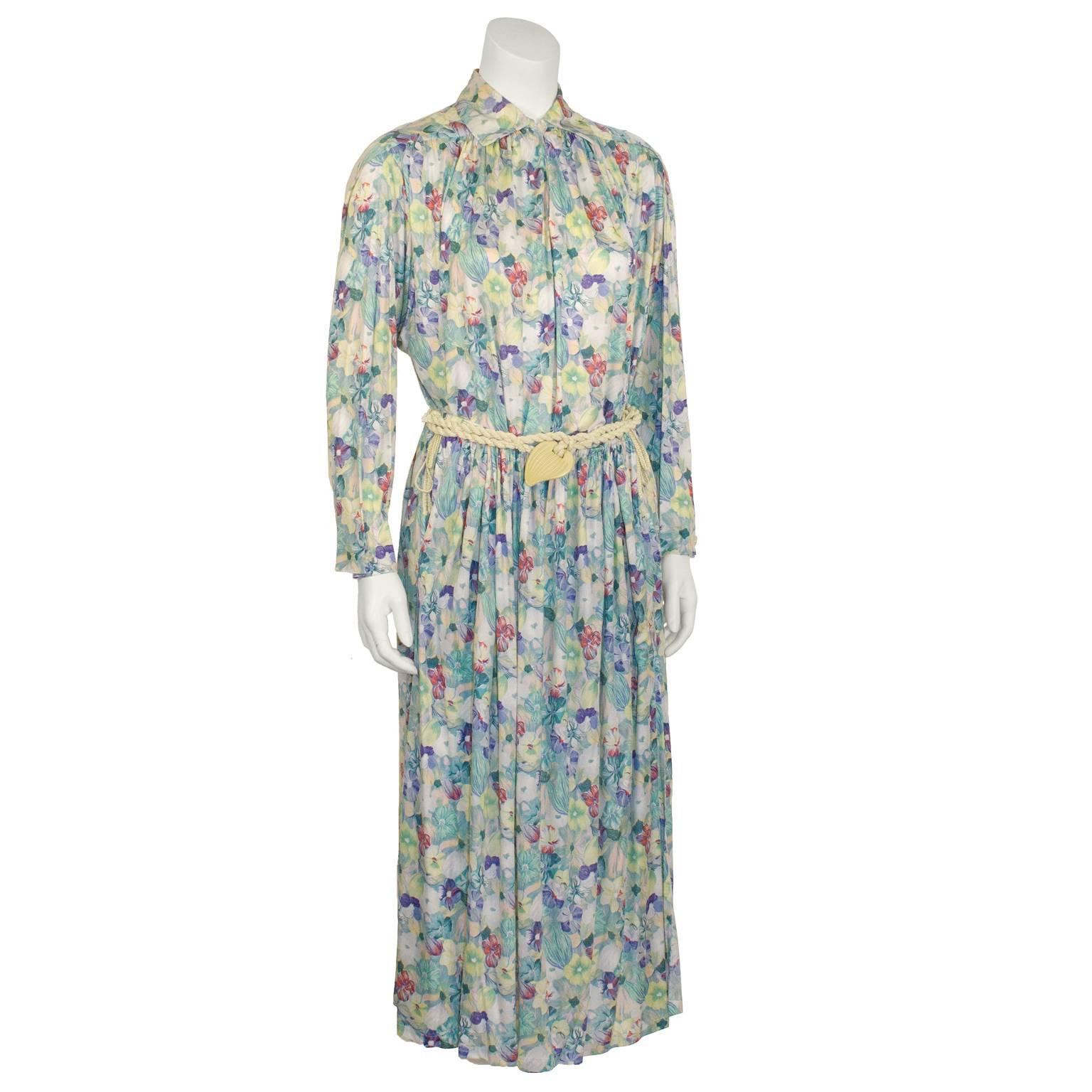 Adorable and extra soft silk jersey Missoni floral ensemble dating from the 1970's. Collared long sleeve blouse has a single button at the neck and a keyhole slit. Mid-length skirt has an elasticized waist and two large slits. Cute white roped belt