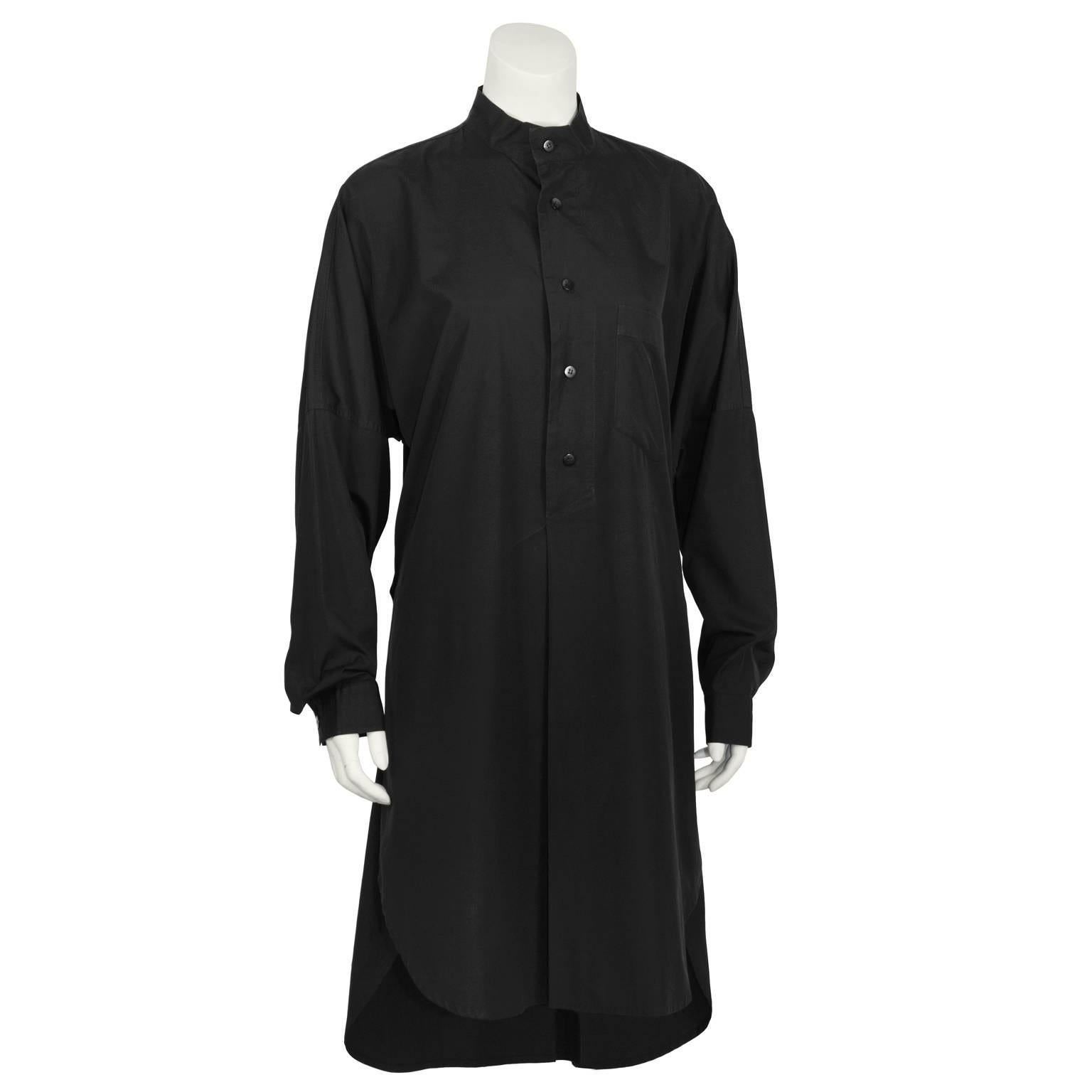 Ultra chic Plantation line by Issey Miyake black cotton tunic dress from the early 1980's featuring a button up neck with a band collar, a breast pocket, a belt around the back with an extended tail. Excellent vintage condition. Fits like a US 6-8.