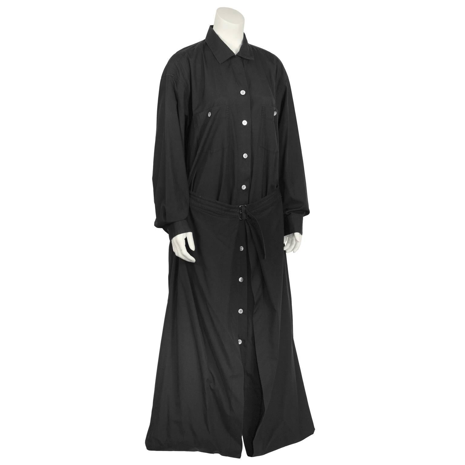 Amazing Issey Miyake black cotton maxi length shirt dress from the 1980's constructed with a notched collar, front button closure, two breast pockets, and a waist belt. Fabulous and unique balloon skirt with a fold over hem. Excellent vintage